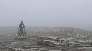 statue of king arthur on the top of tintagel cliffs